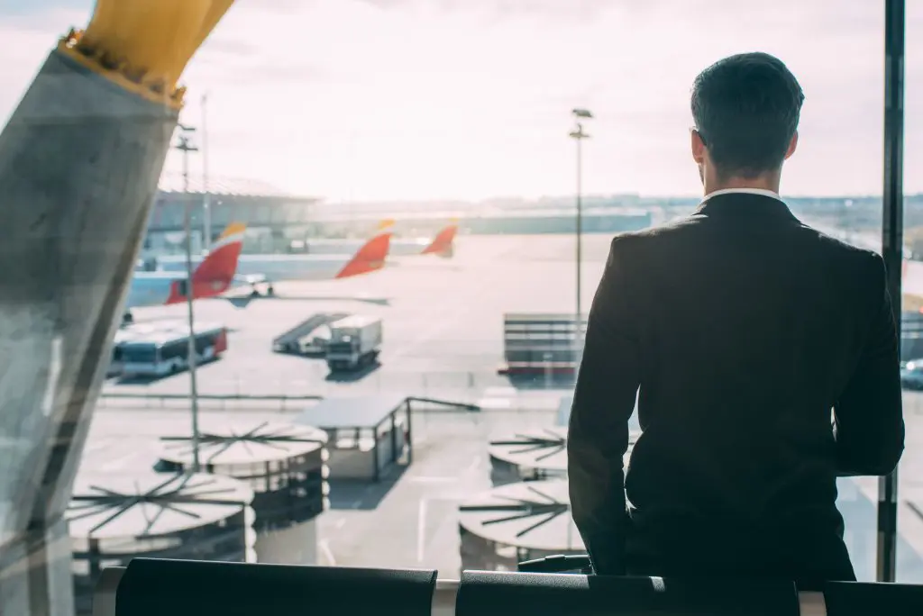 Businessman stood in an airport